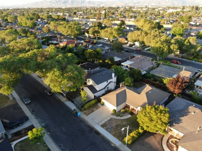 Preconstruction planning for a residential neighborhood project with aerial views of homes and surrounding streets
