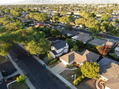 Preconstruction planning for a residential neighborhood project with aerial views of homes and surrounding streets